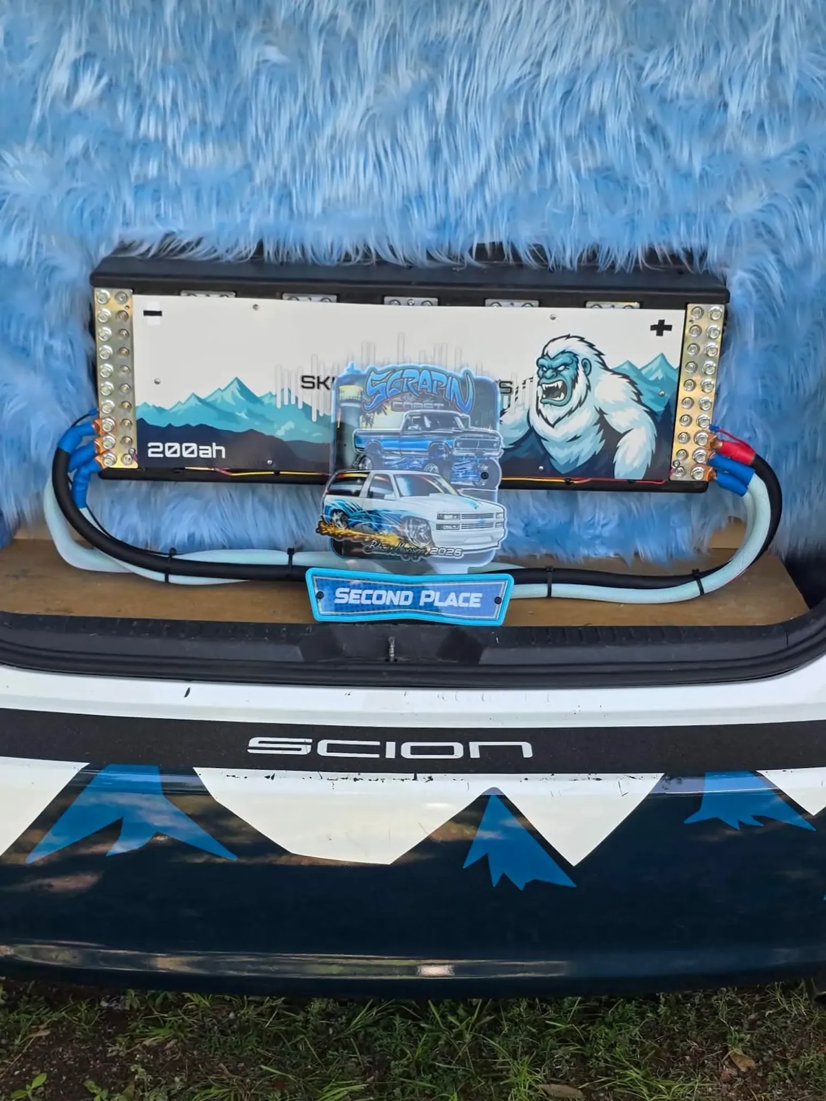 Yeti's hatch lined in blue fur, with a 200 Ah battery bank wrapped in a snarling yeti graphic and a Scrapin' the Coast, Biloxi, Mississippi 2026 second-place award in front.